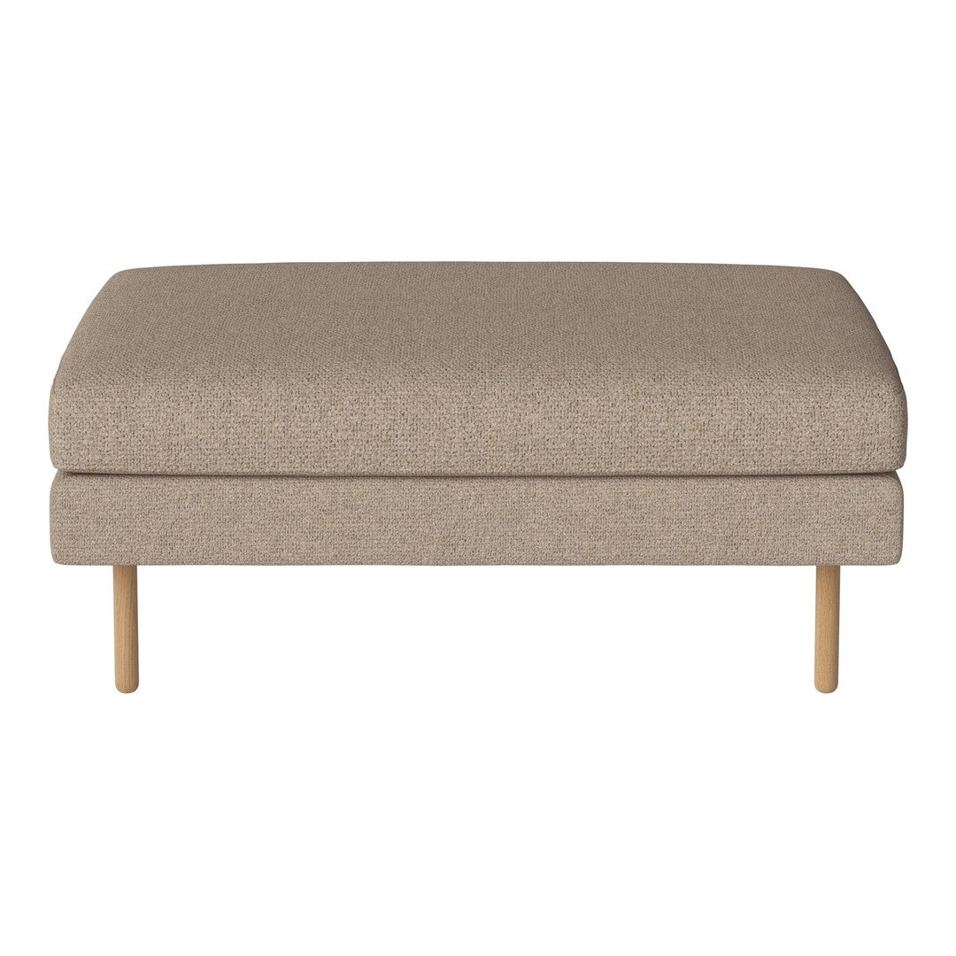 Beige upholstered ottoman with a smooth, textured surface and light wooden legs. Ideal for versatile decor.