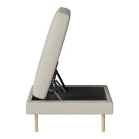 Light beige fabric upholstered chaise lounge with a minimalist design and natural wood legs. Elegant and modern style.