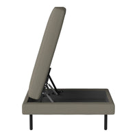 Gray upholstered bed frame with a streamlined design and subtle textured pattern, showcasing a minimalist aesthetic.