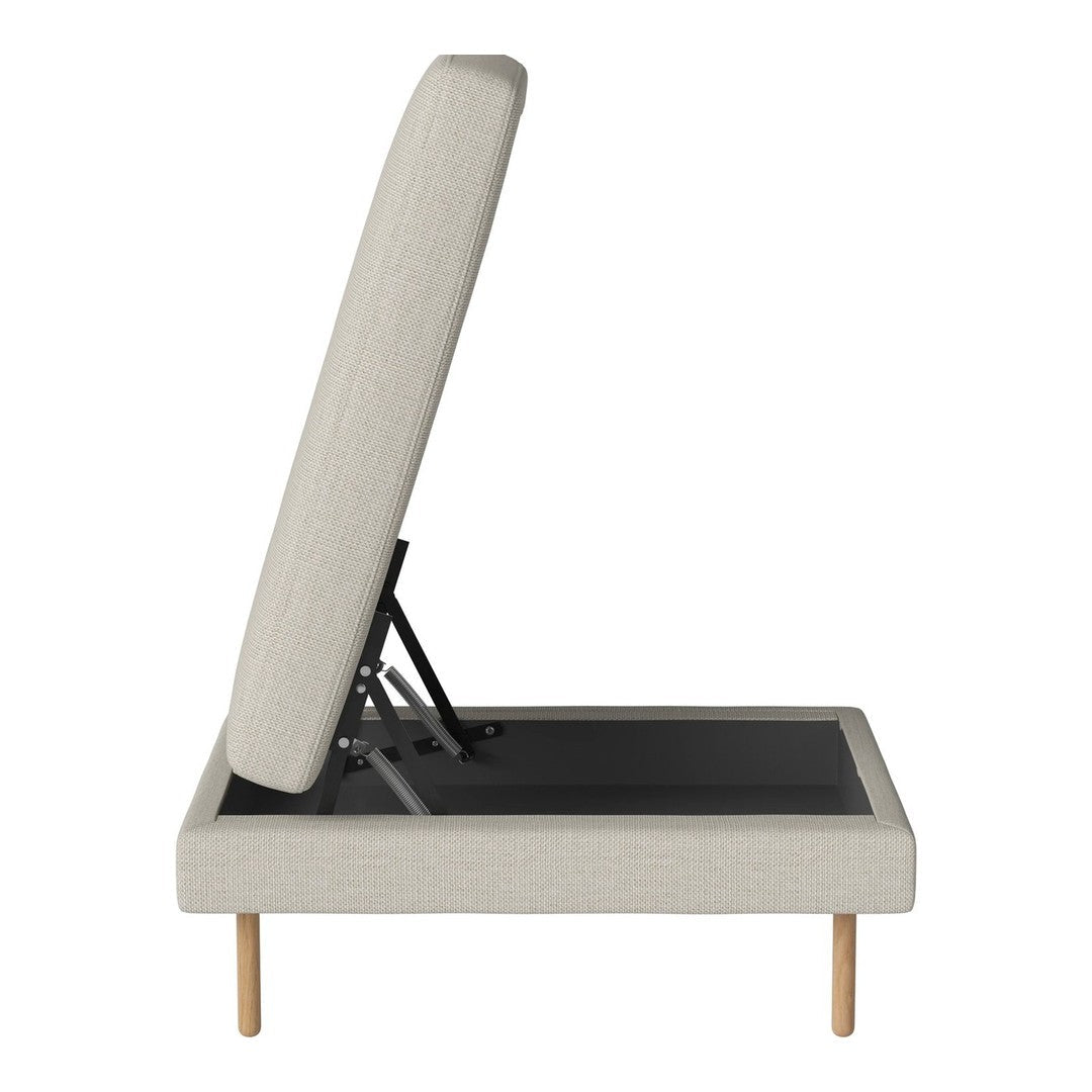 Light beige upholstered storage ottoman with a minimalist design and natural wood legs. Simple, modern pattern.