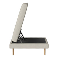Light beige upholstered storage ottoman with a minimalist design and natural wood legs. Simple, modern pattern.