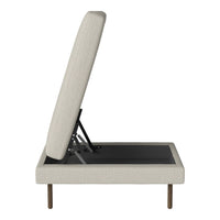Cream-colored upholstered storage bed with a textured finish and sleek black base. Modern and minimalist design.