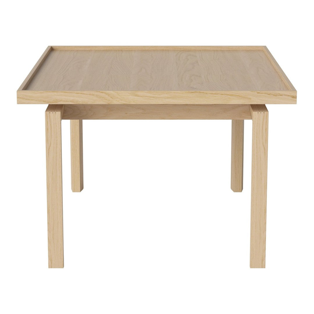 Light oak wood table with a smooth finish and minimalist design, featuring natural grain patterns.