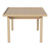 Light oak wood table with a smooth finish and minimalist design, featuring natural grain patterns.