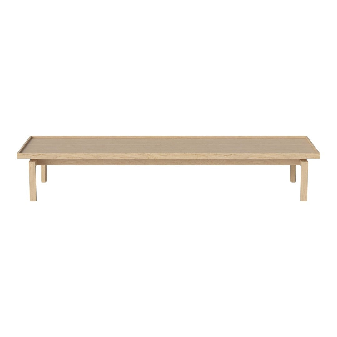 Light beige rectangular table with a smooth surface and simple, clean lines; modern minimalist design.