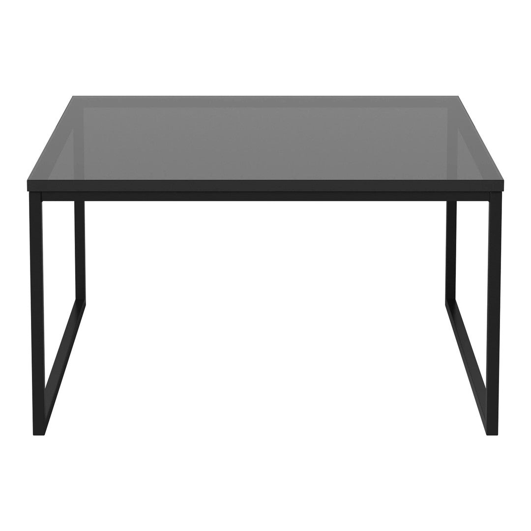 Black metal frame table with a sleek, matte finish and a clear glass top, ideal for modern decor.
