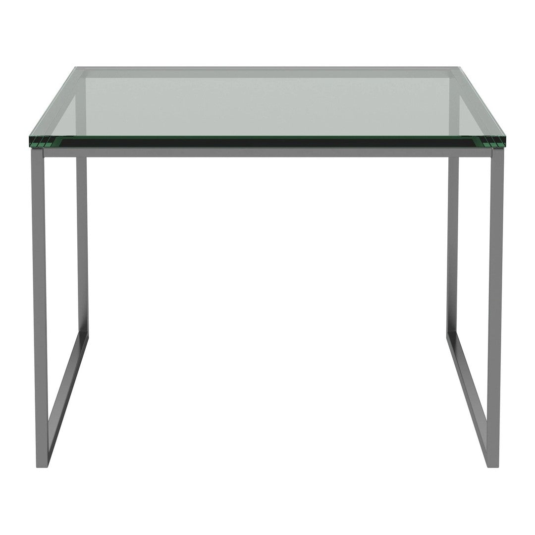 Modern clear glass table with sleek silver metal frame, showcasing minimalist design and contemporary style.