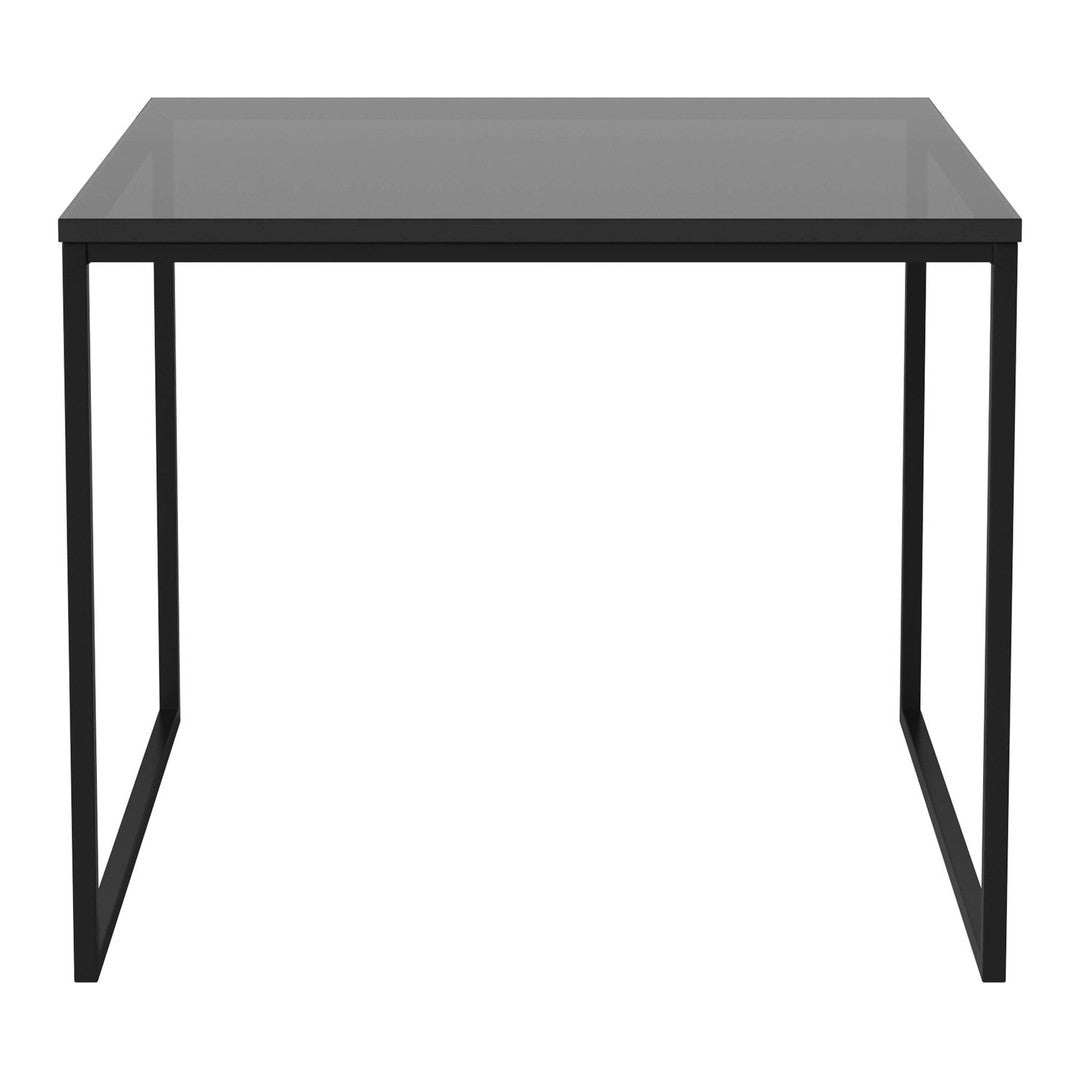 Modern black metal frame table with a sleek, glossy gray tabletop, perfect for minimalist decor.
