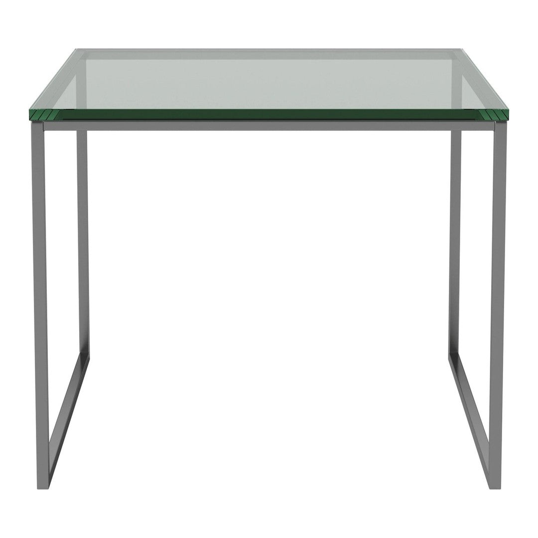 Clear glass table with a sleek silver metal frame, showcasing a modern minimalist design.