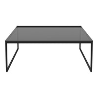 Sleek black coffee table with a smooth glass top and minimalist design, perfect for modern interiors.