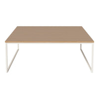 Wooden tabletop with a smooth finish, light beige color and minimalist white metal legs. Stylish and modern design.