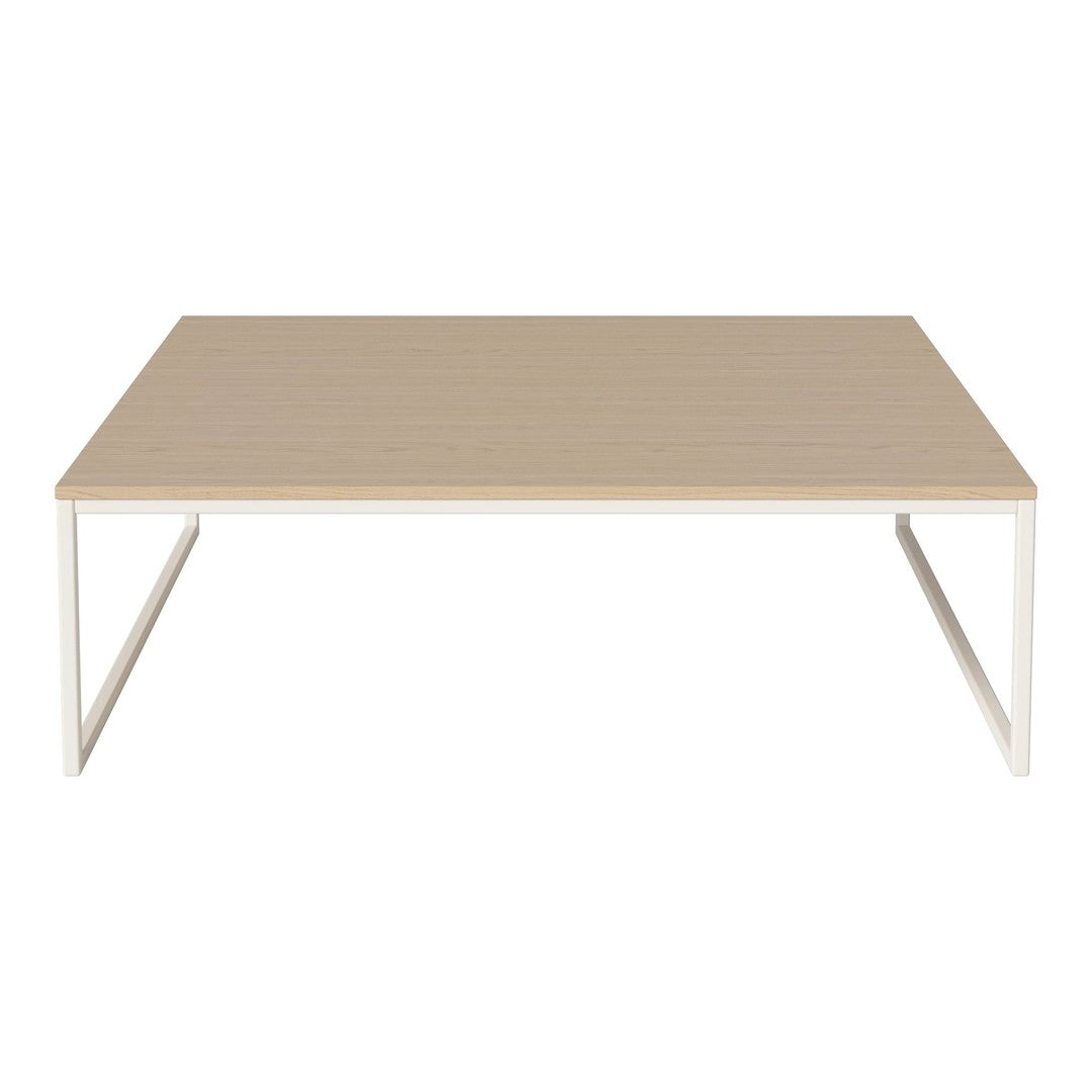 Light wood coffee table with a smooth surface and minimalist white metal legs. Simple, modern design.