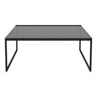 Modern black frame coffee table with a sleek glass top, featuring a minimalist design and smooth surfaces.