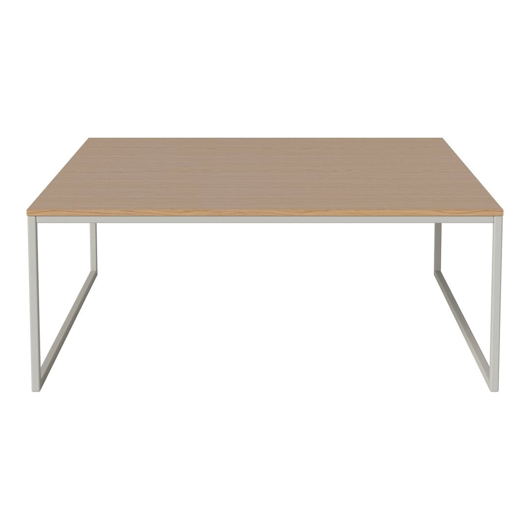 "Modern rectangular table with a light wood grain surface and sleek silver metal legs."