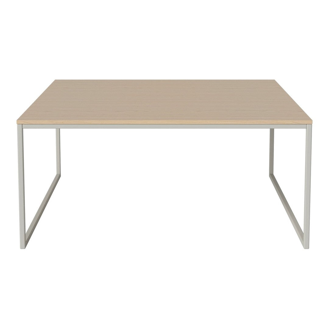 Light beige rectangular tabletop with a sleek silver metal frame, showcasing a modern minimalist design.