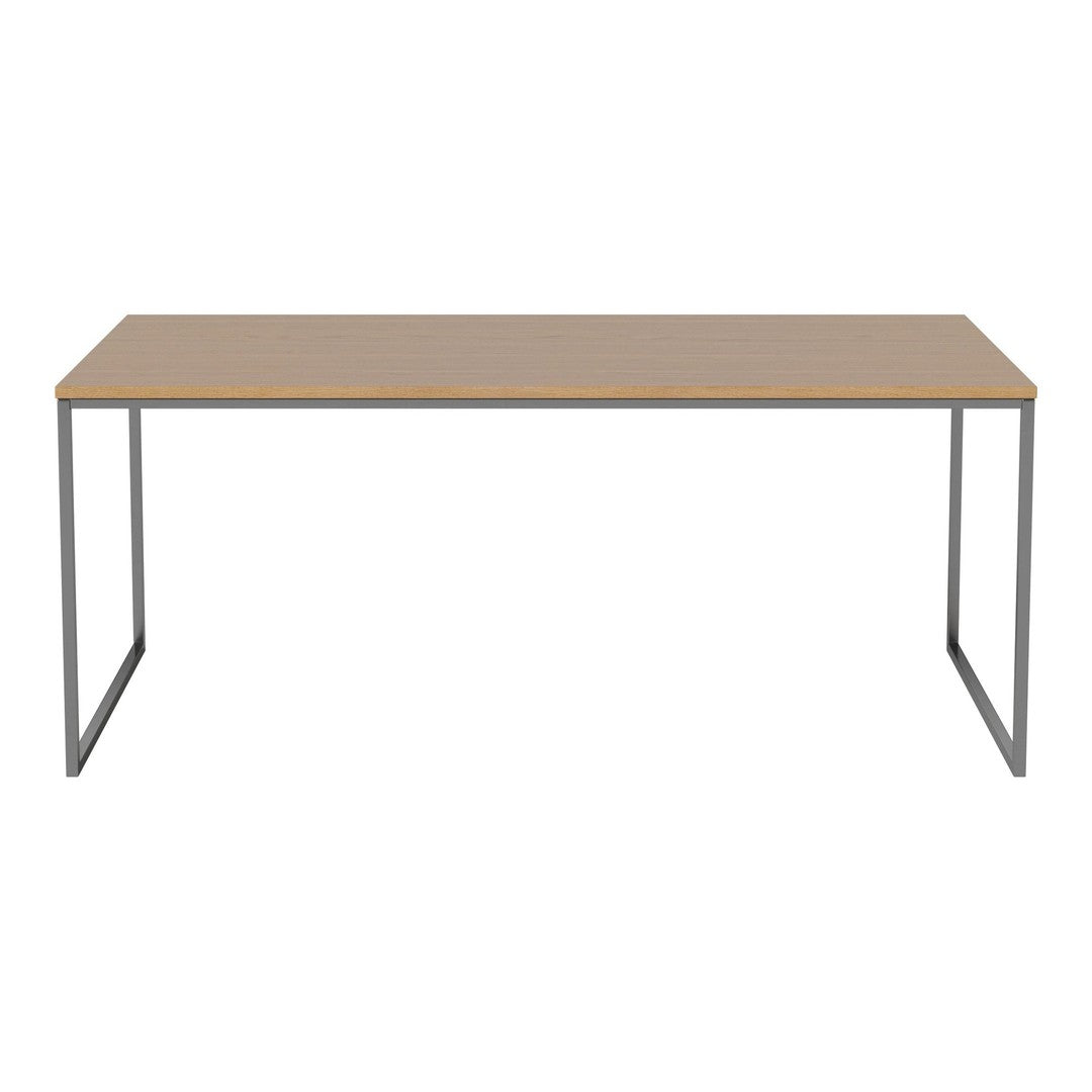Modern rectangular table with a light wood top and sleek silver metal legs. Minimalist design with neutral colors.