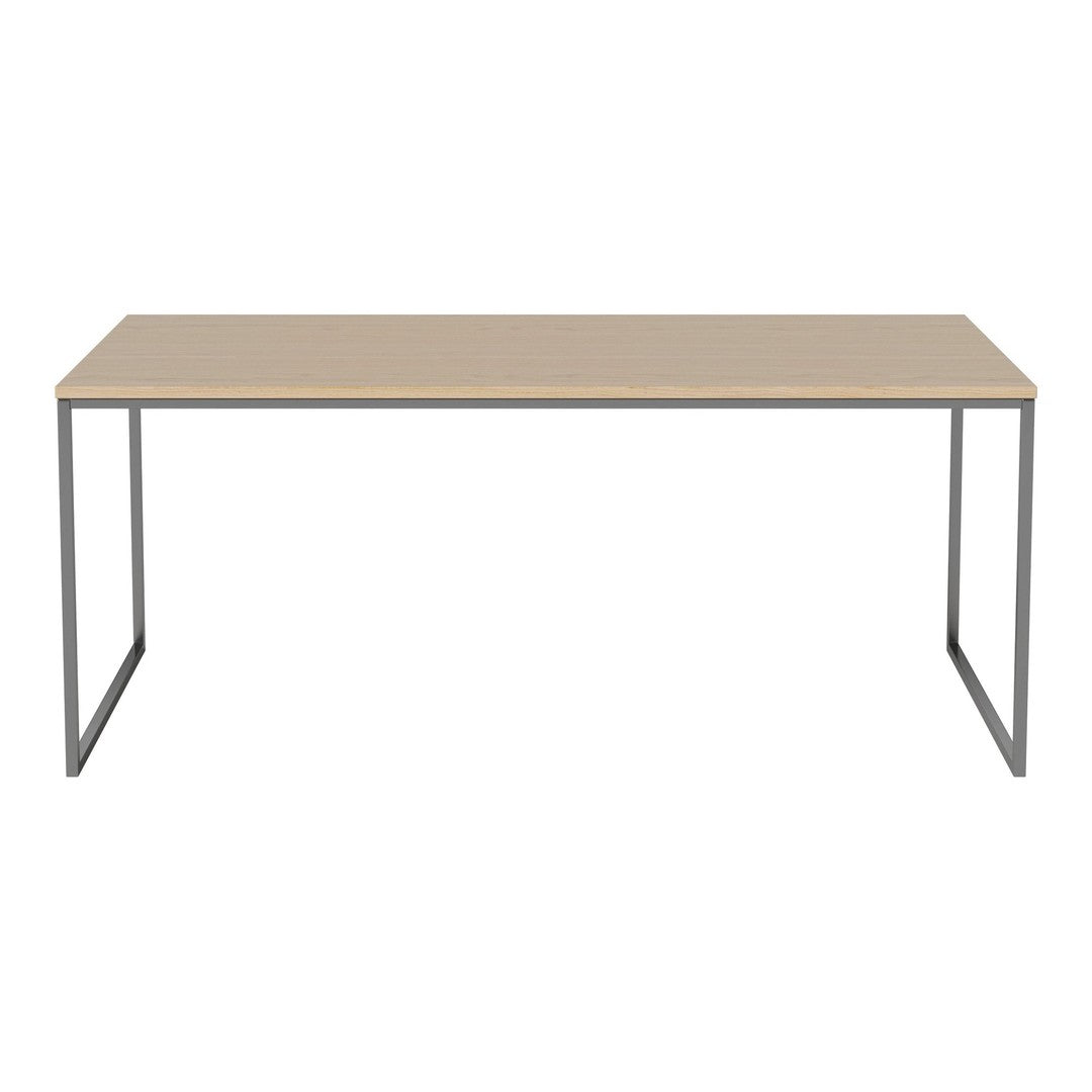 Minimalist beige desk with sleek gray metal legs, perfect for modern workspace styling.