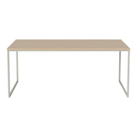 Minimalist beige table with a smooth surface and sleek silver metal legs, perfect for modern decor.