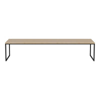 Modern light wood rectangular tabletop on black metal legs, featuring a sleek, minimalist design. Perfect for any space.
