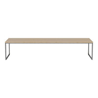 Light beige tabletop with a smooth, minimalist finish and sleek, silver metal legs. Perfect for modern decor.