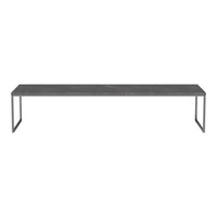 Long black marble table with a sleek metallic frame, featuring a minimalist design and subtle gray veining.