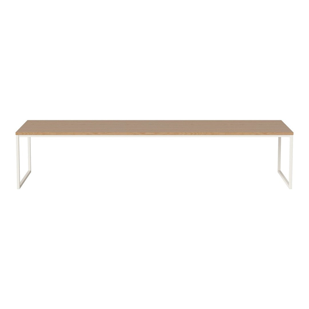 Minimalist rectangular table with a light wood surface and white metal legs, perfect for modern interiors.