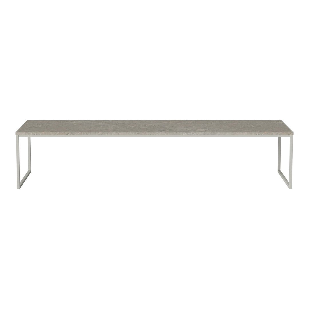 Long, rectangular table with a sleek gray top and modern silver legs, showcasing a minimalist design.