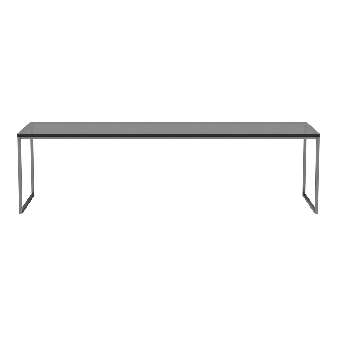 Sleek black metal frame table with a smooth grey top, perfect for modern decor. Minimalist design complements any space.
