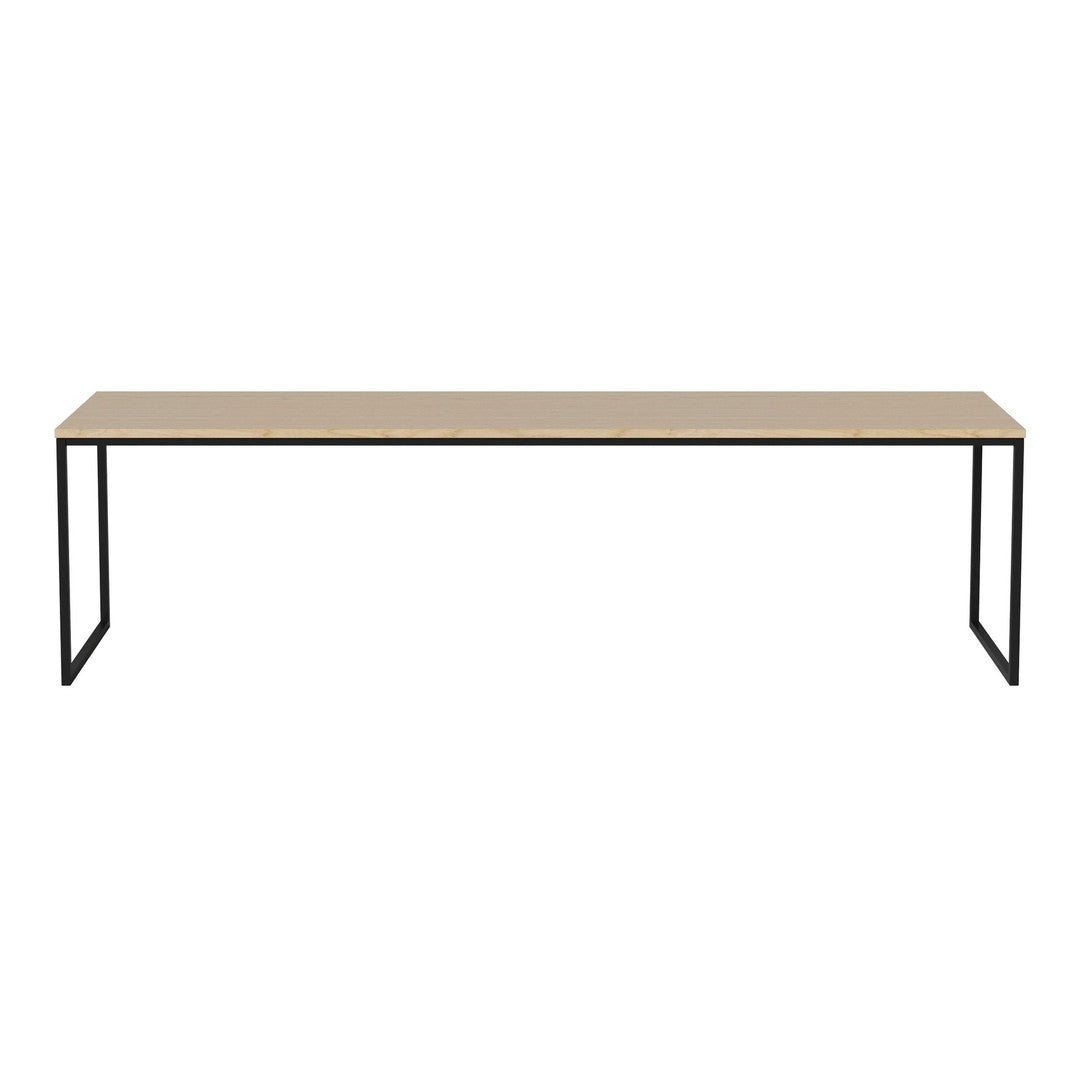 Minimalist rectangular table with a natural wood top and sleek black metal legs, showcasing a simple, modern design.