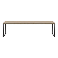 Minimalist rectangular table with a natural wood top and sleek black metal legs, showcasing a simple, modern design.