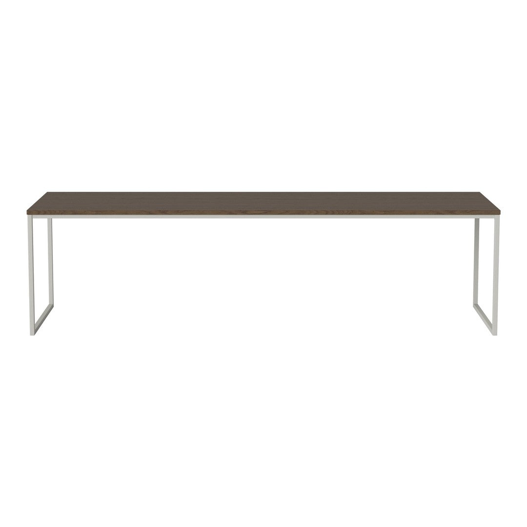 Long brown tabletop with sleek silver legs, featuring a minimalist design for modern decor.