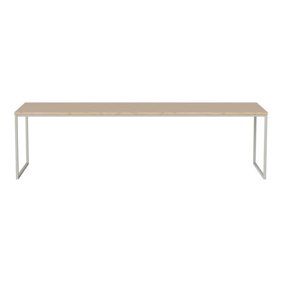 Light wood tabletop with a smooth finish and sleek silver metal legs, offering a minimalist and modern design.