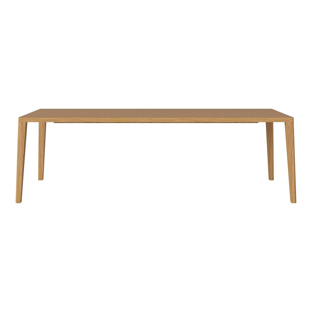 "Rectangular wooden table in natural wood finish, featuring smooth surfaces and simple lines."