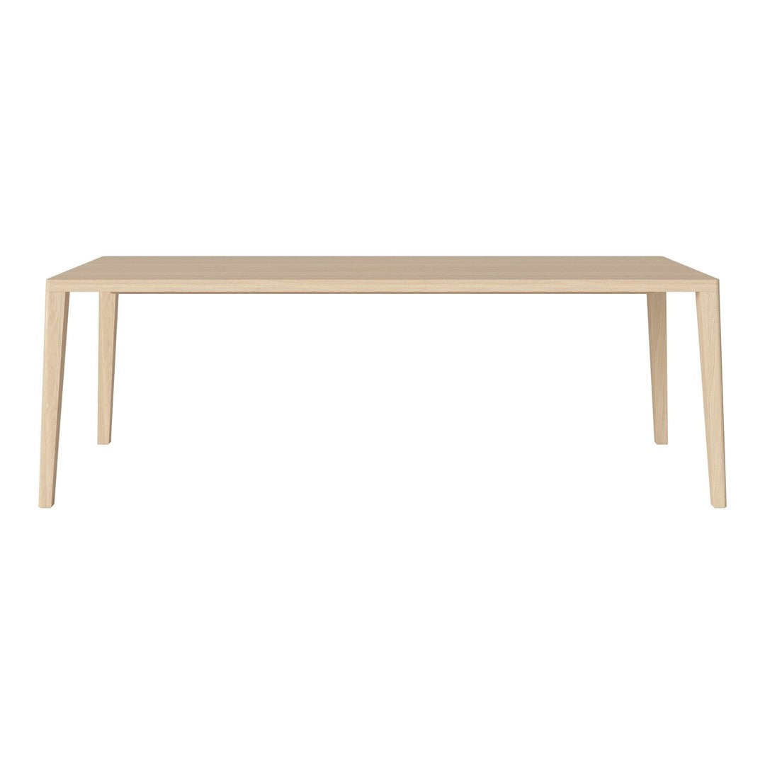 Light beige rectangular dining table with clean lines and smooth surface, perfect for modern interiors.