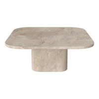 Light beige rectangular coffee table with a smooth, natural stone texture and rounded edges. Modern minimalist design.