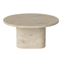 Round beige stone coffee table with a smooth surface and cylindrical base, showcasing a minimalist design.
