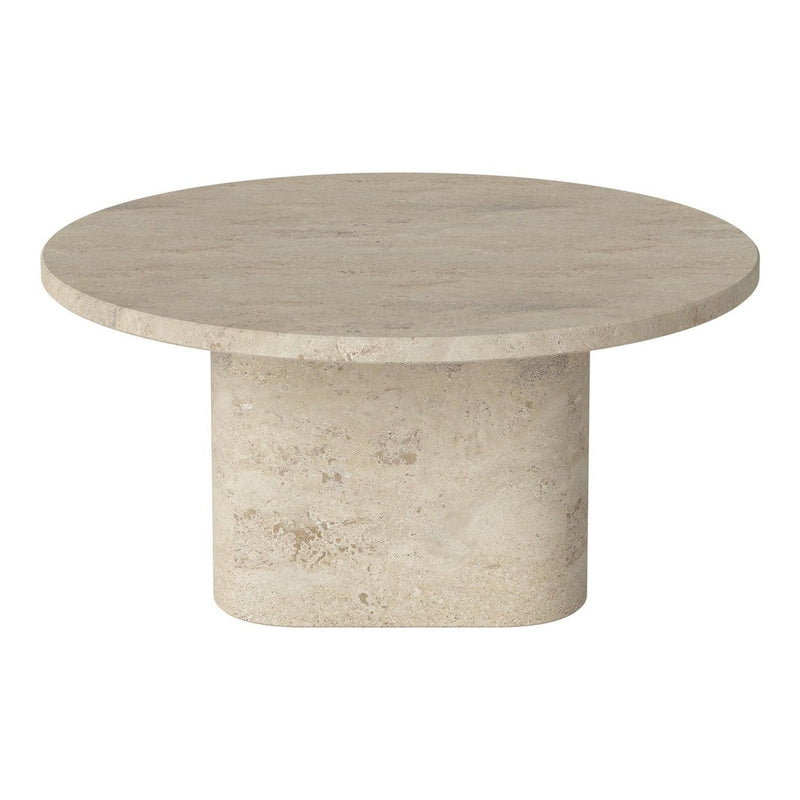 Round beige stone coffee table with a smooth surface and cylindrical base, showcasing a minimalist design.