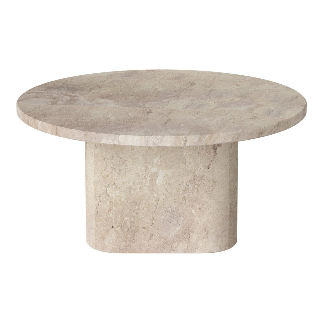 Round beige travertine table with a smooth, matte finish and subtle natural patterns. Ideal for modern decor.