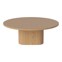 Round wooden coffee table in light oak finish with a smooth surface and cylindrical base design.
