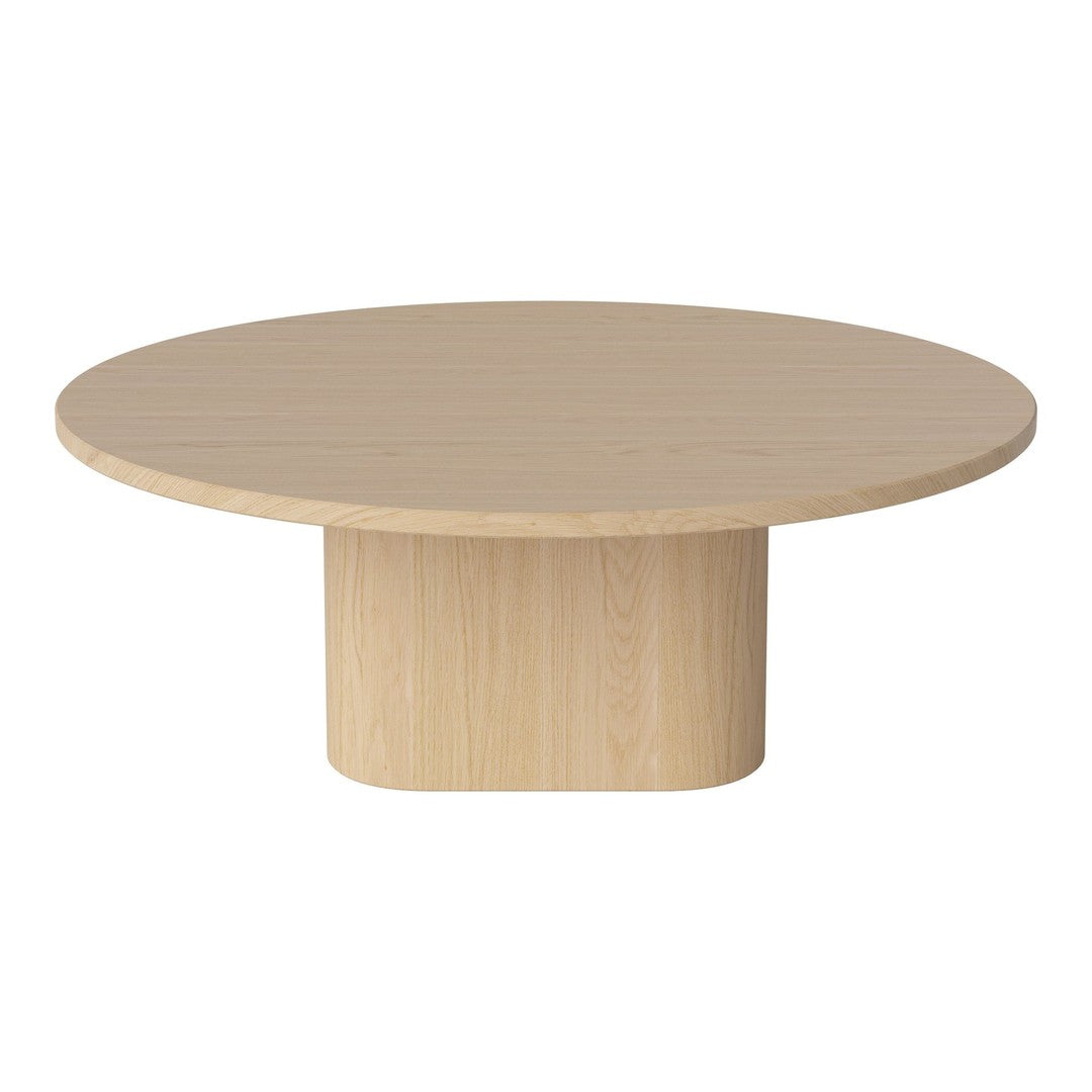Round light wood coffee table with a smooth, natural finish and minimalist design. Perfect for modern decor.