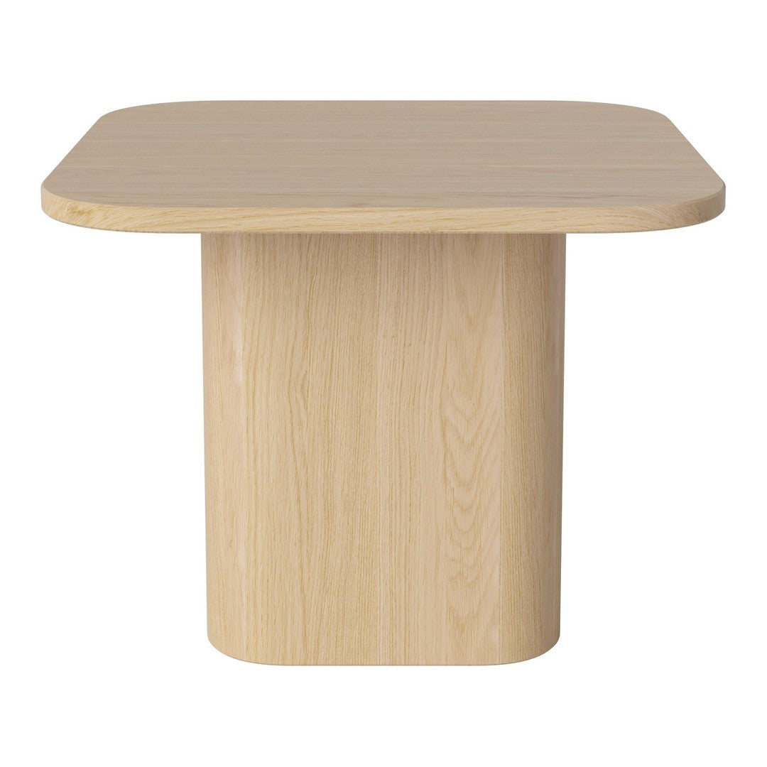 Light beige wooden table with a smooth, minimalist design and rounded edges, perfect for modern decor.