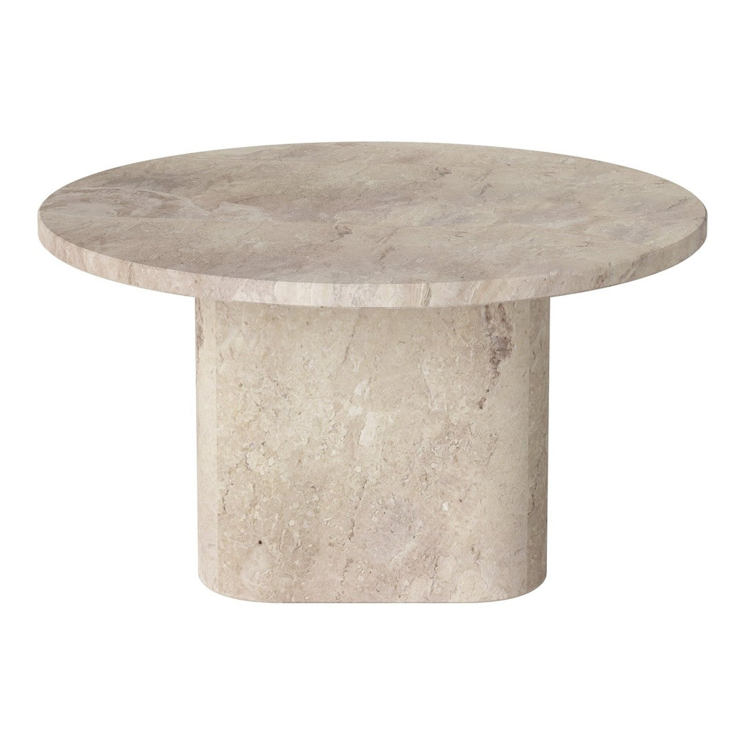 Round beige stone table with a smooth surface and solid cylindrical base, showcasing a natural texture.