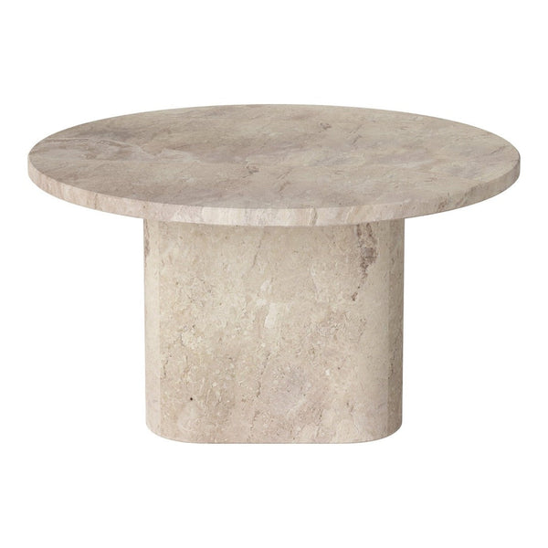 Round beige stone table with a smooth surface and solid cylindrical base, showcasing a natural texture.