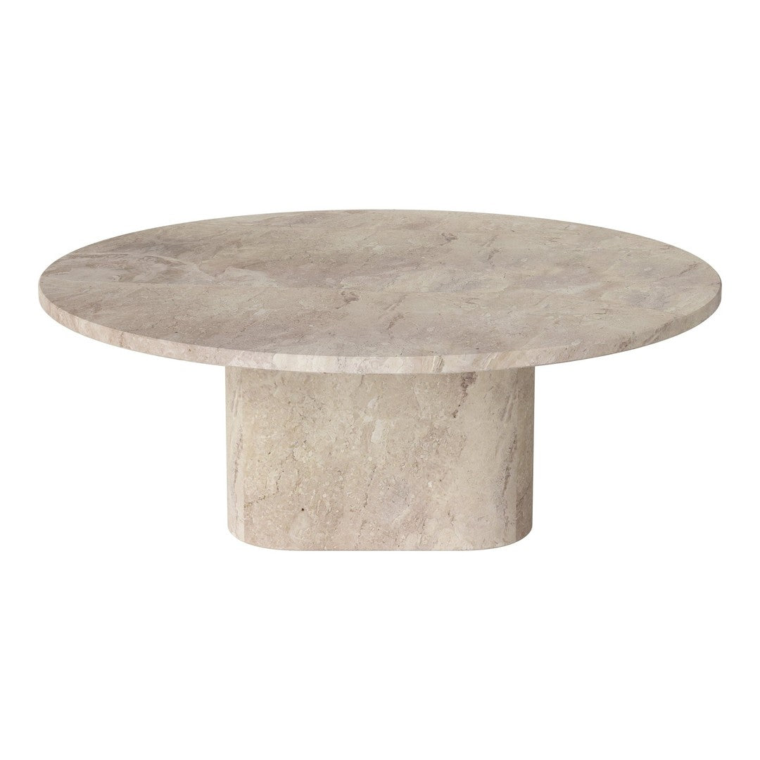 Round beige stone coffee table with a smooth, solid surface and a minimalist cylindrical base.