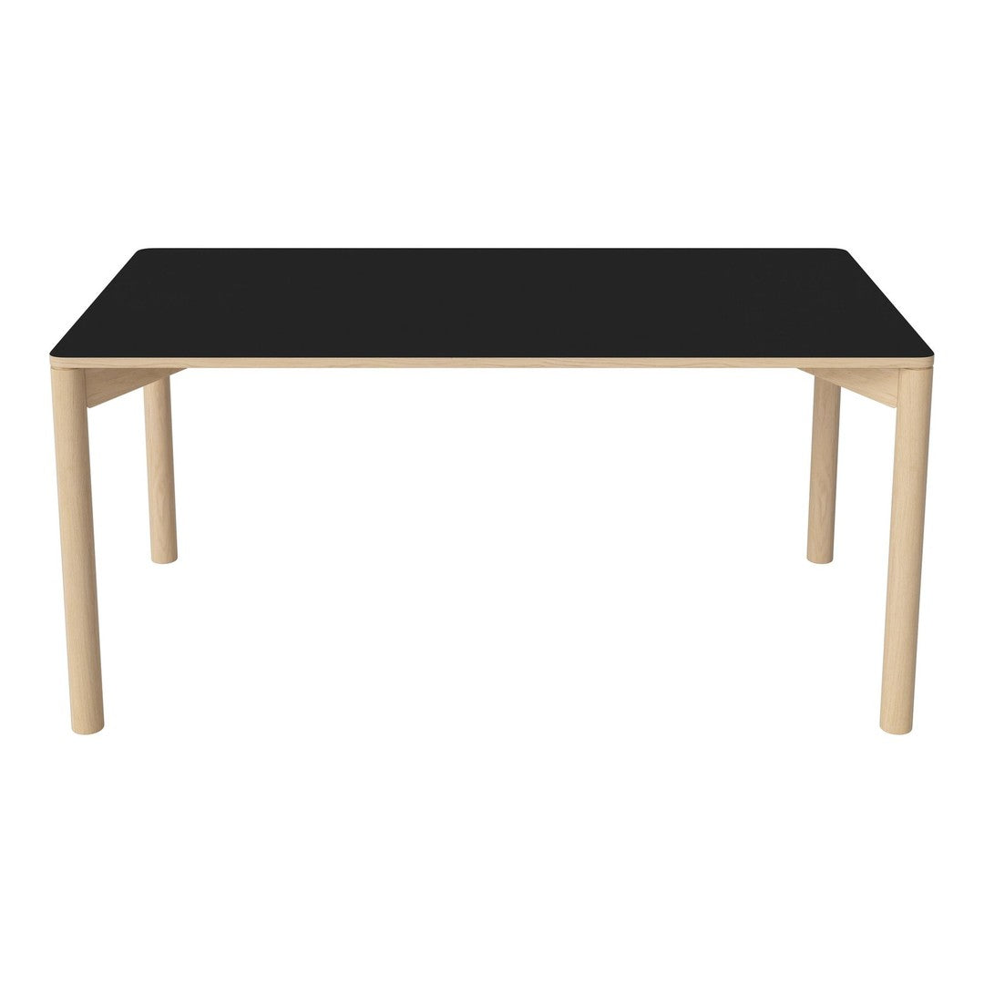 Black tabletop with natural wood legs, featuring a sleek and minimalist design. Perfect for modern decor.