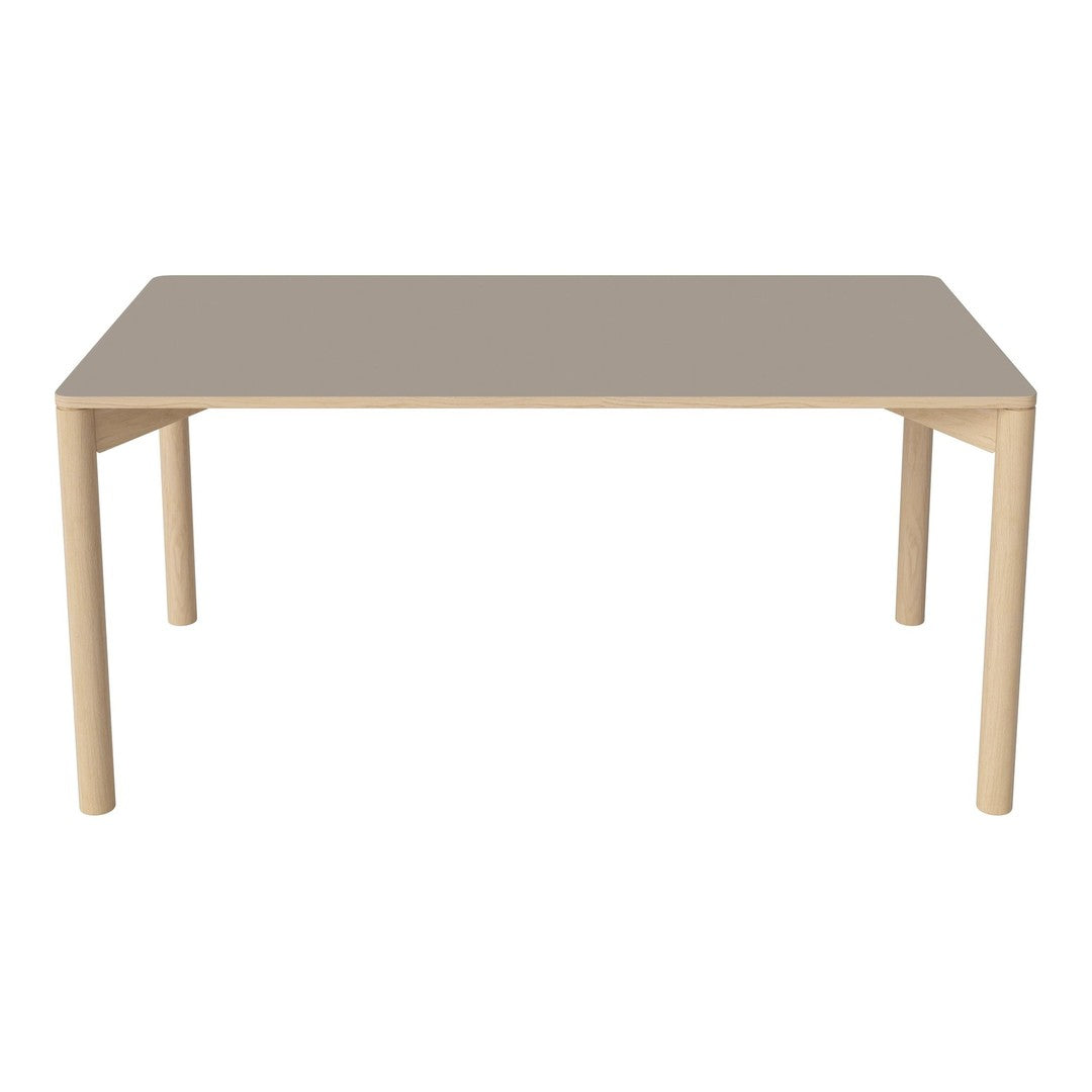 "Modern rectangular dining table with a smooth taupe surface and light wood legs, featuring a minimalist design."