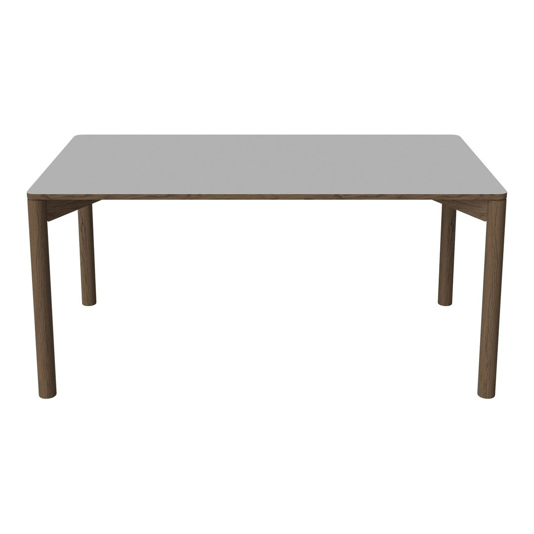 Gray rectangular tabletop with light brown wooden legs, featuring a sleek, modern design. Perfect for any dining space.
