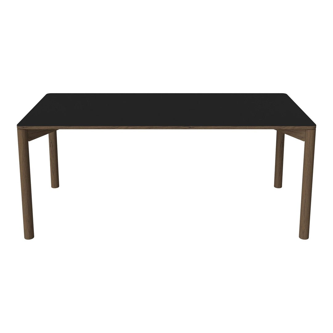 Black tabletop dining table with wooden legs, showcasing a sleek and modern design. Perfect for contemporary spaces.