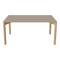 Light wood dining table with a sleek, smooth gray surface and minimalist design. Ideal for modern interiors.
