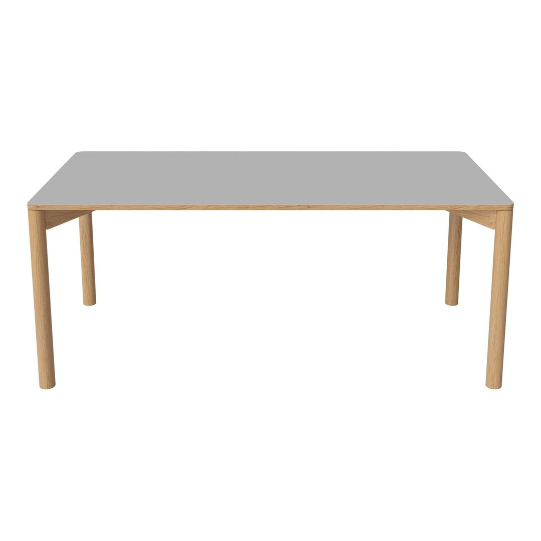Gray tabletop with a smooth finish, supported by natural wood legs, offering a modern and minimalistic look.